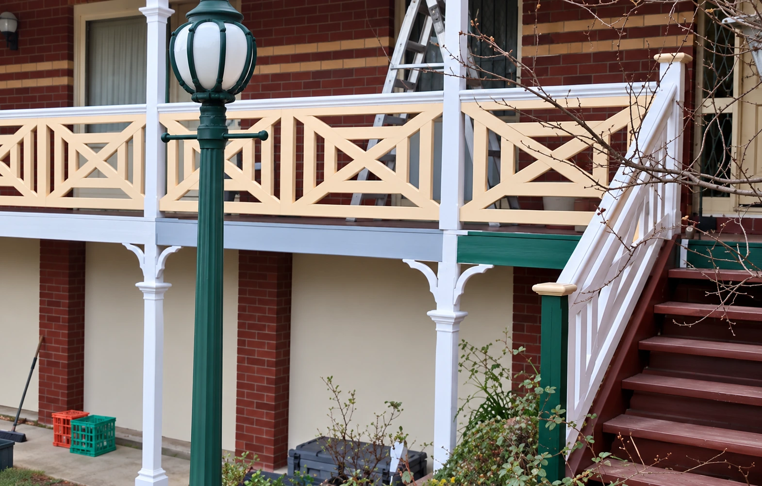 Cross panels on heritage brick verandah; restored photograph